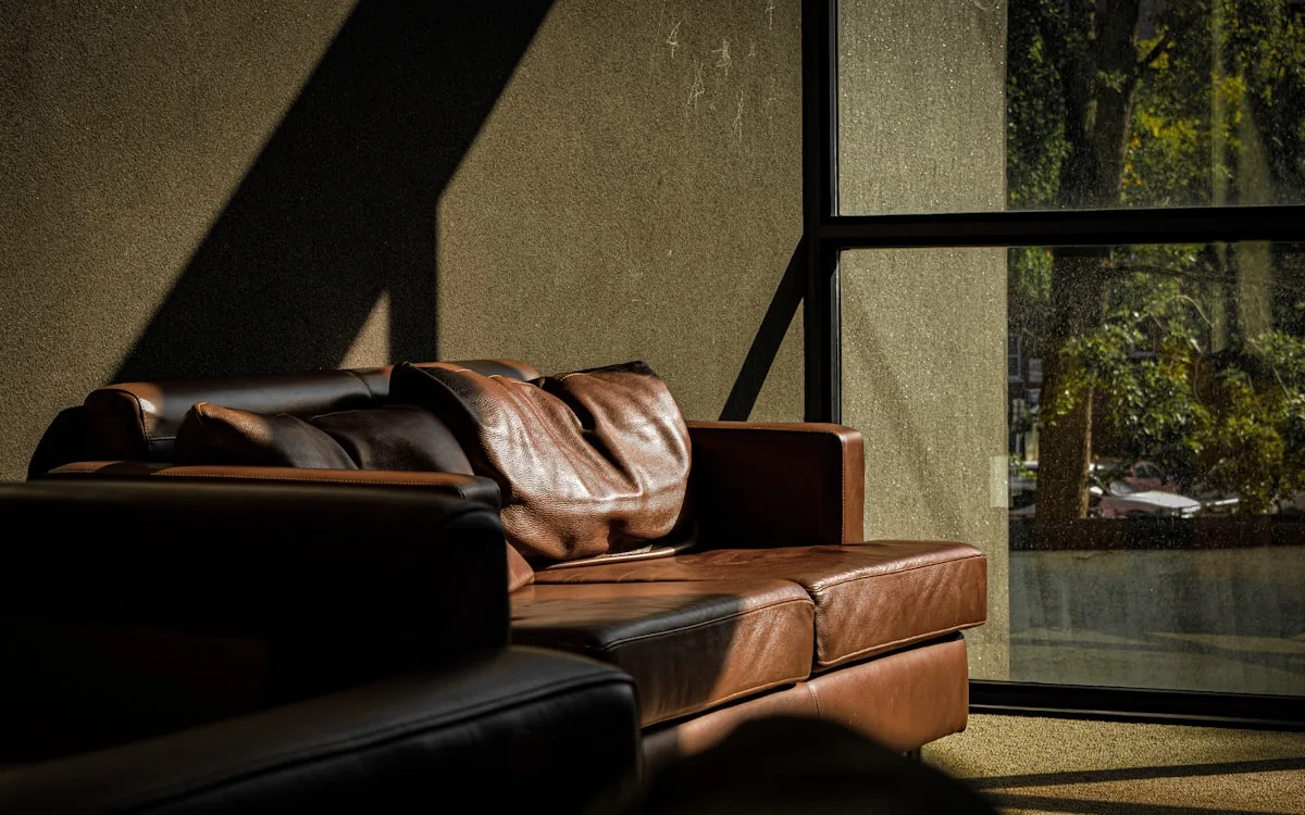 Modern apartment living room with disassembled furniture and wrapped items positioned for pickup in Discovery Gardens Dubai