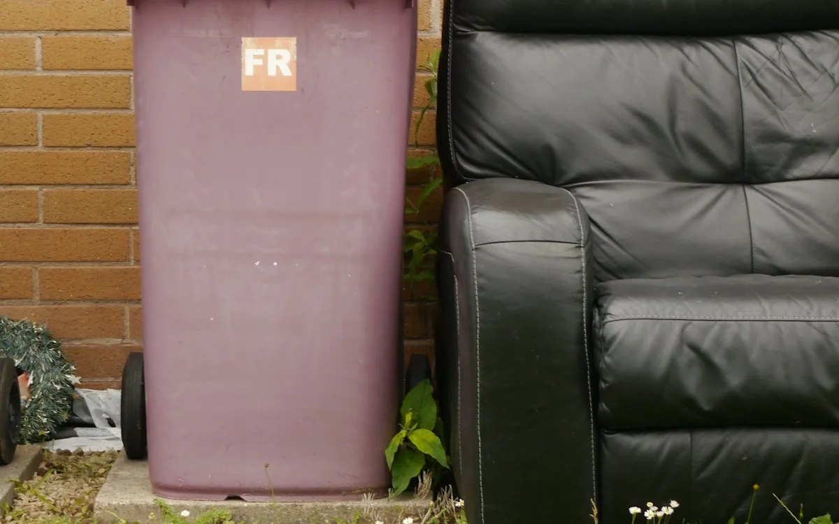 Heavy solid-wood furniture, luxury lounge seating, and domestic furnishings staged for collection