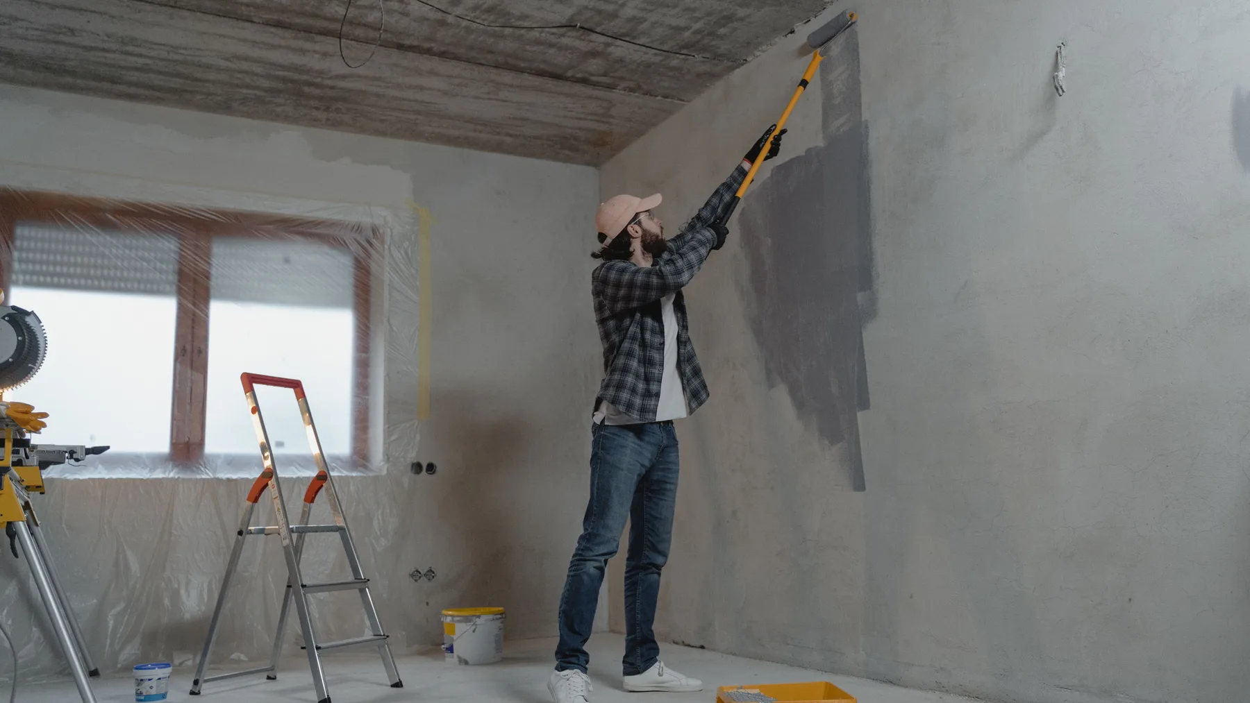 Contractor clearing interior renovation waste and commercial kitchen strip-out debris in Dubai