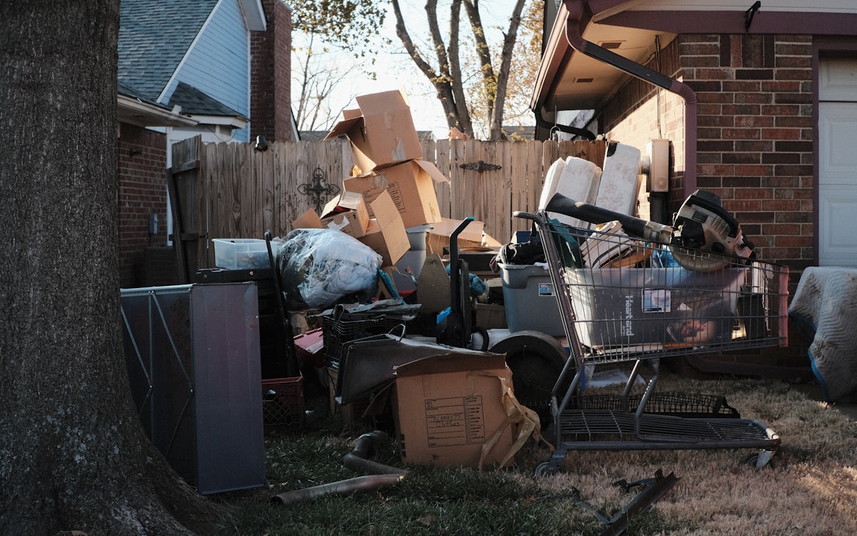Pile of bulky household junk stacked outside a home awaiting collection