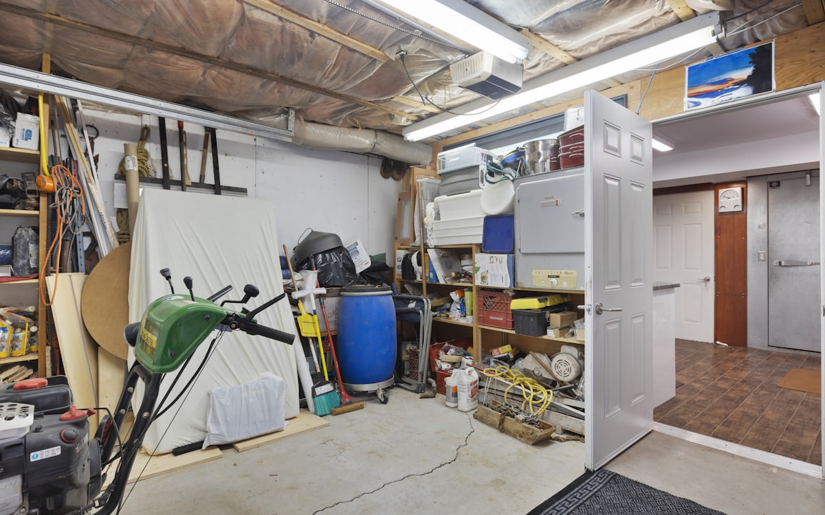 Cluttered garage before a general junk removal Dubai garage cleanup