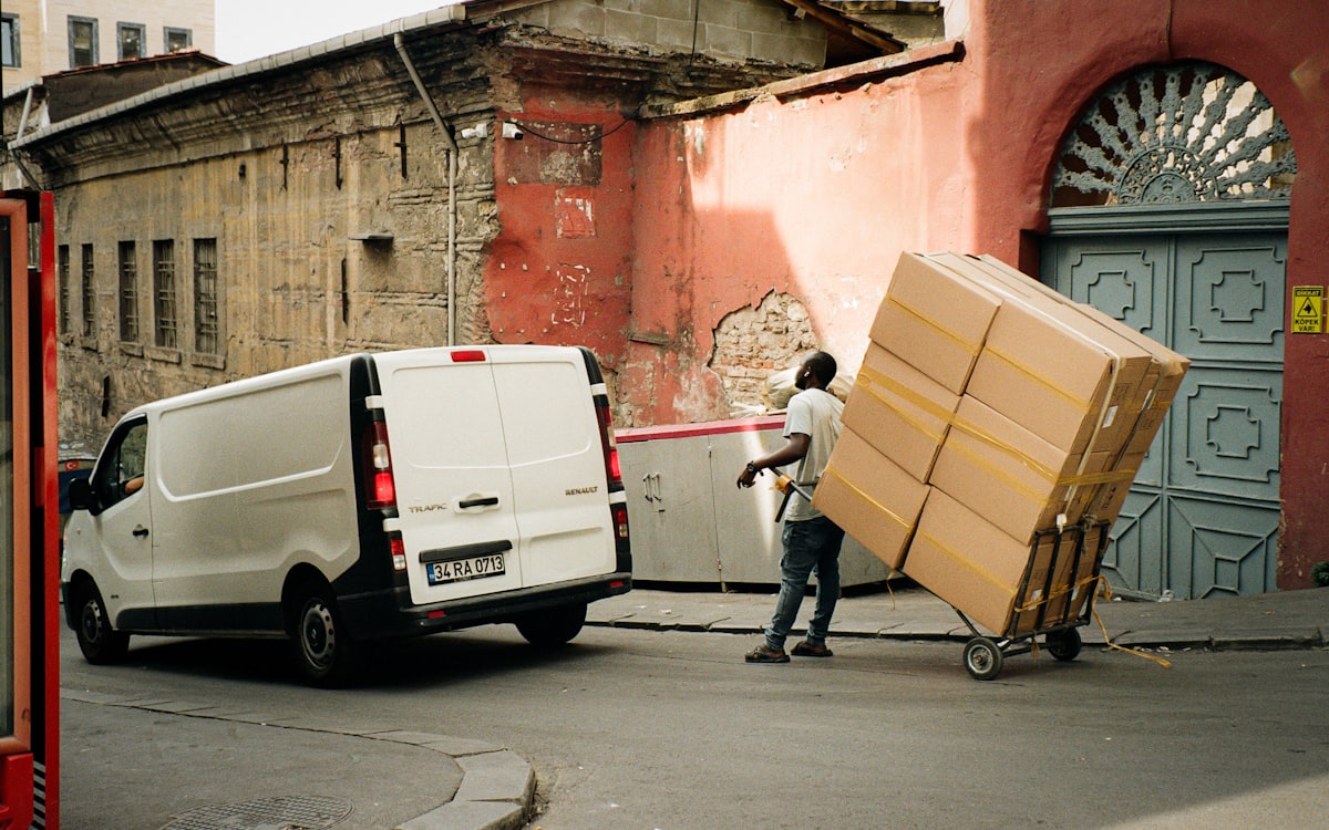 Crew loading boxes into a van for same day junk removal Dubai